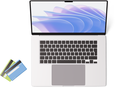 Top view of laptop and two credit cards PNG, SVG