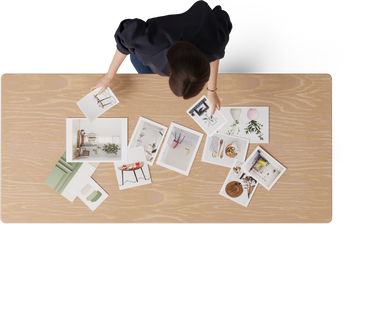top view of young woman going through photos PNG, SVG